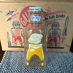 Galaxy By Harvic Clear Bottle with Yellow and Green Accents